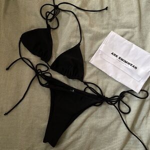 Size small ark bikini top only. strappy, classic black triangle bikini